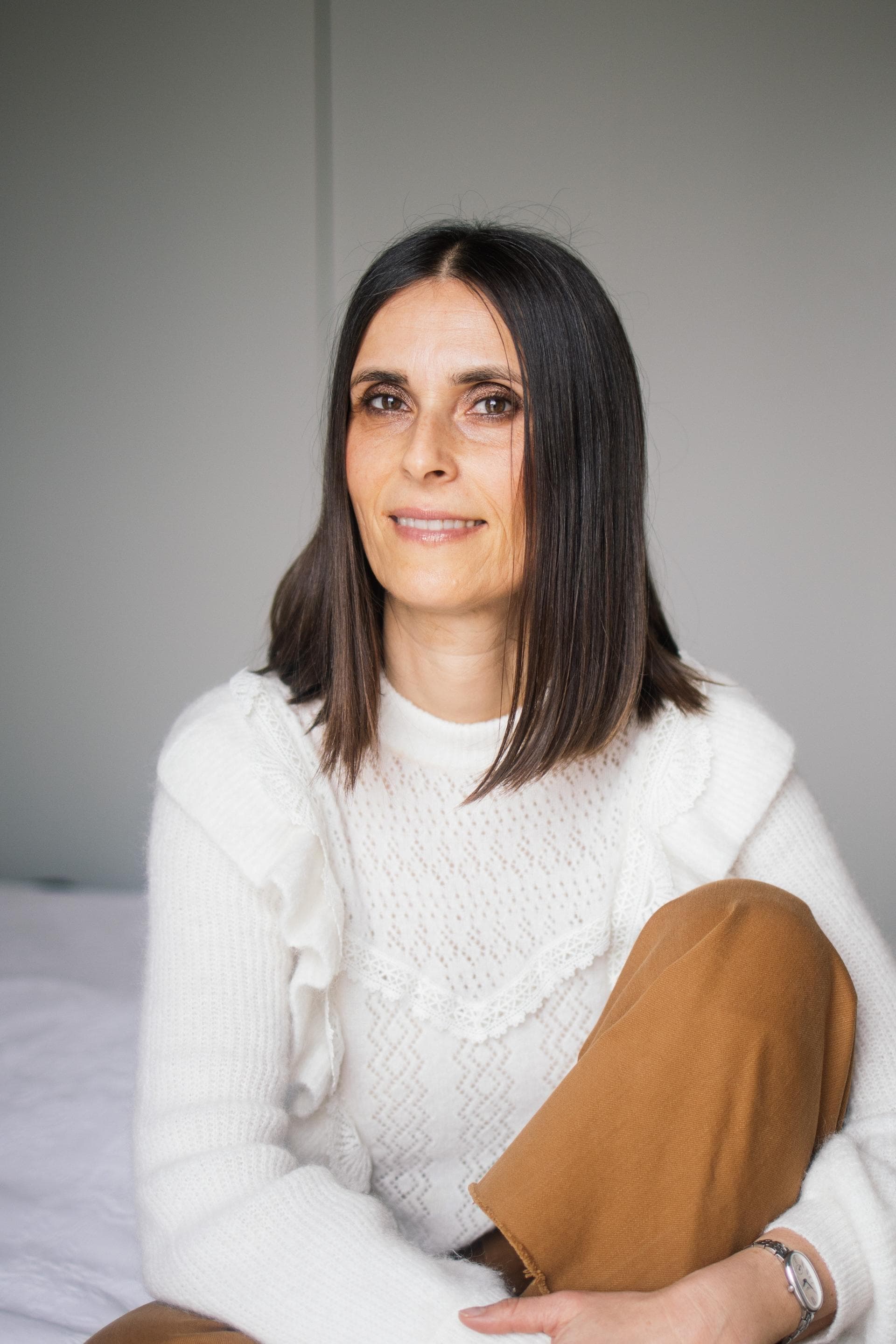 Sandra Drašković sitting by a window